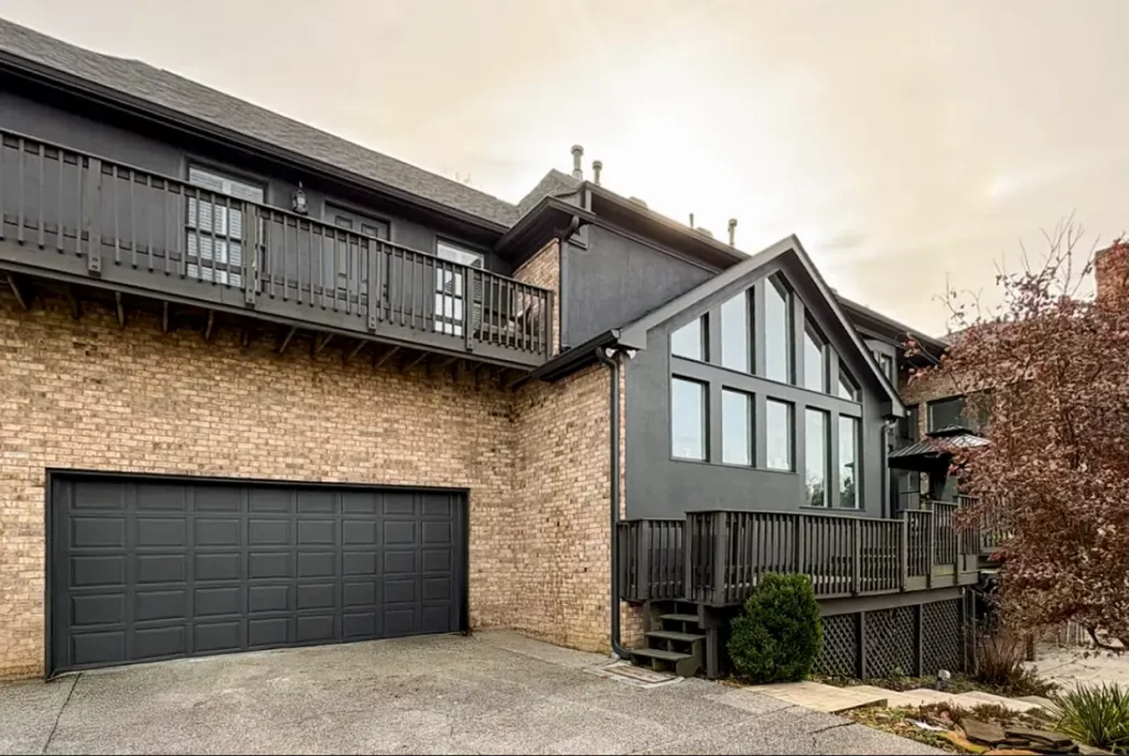Modern black home exterior showing newly painted siding