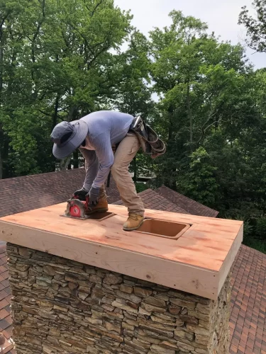 Bridger craftsman completing chimney masonry work